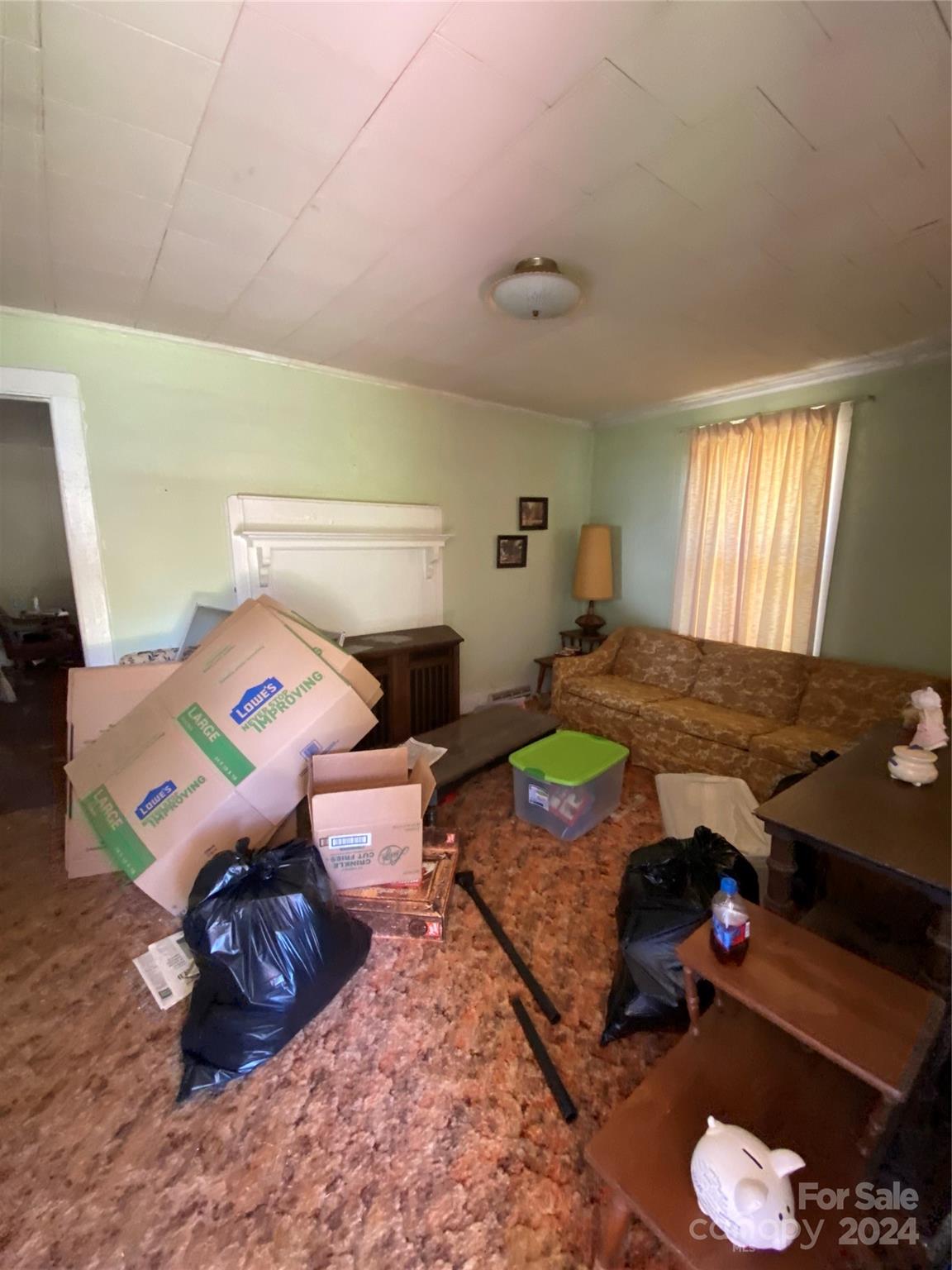 771 Spindale Street Spindale, NC 28160 - Photo 13 of 14 a bed room with a bed window and a couch