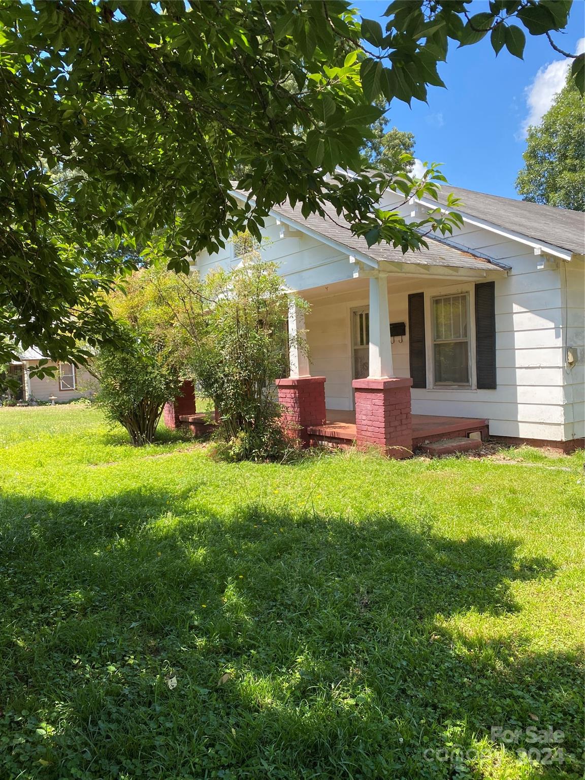 771 Spindale Street Spindale, NC 28160 - Photo 4 of 14 a front view of house with yard and green space