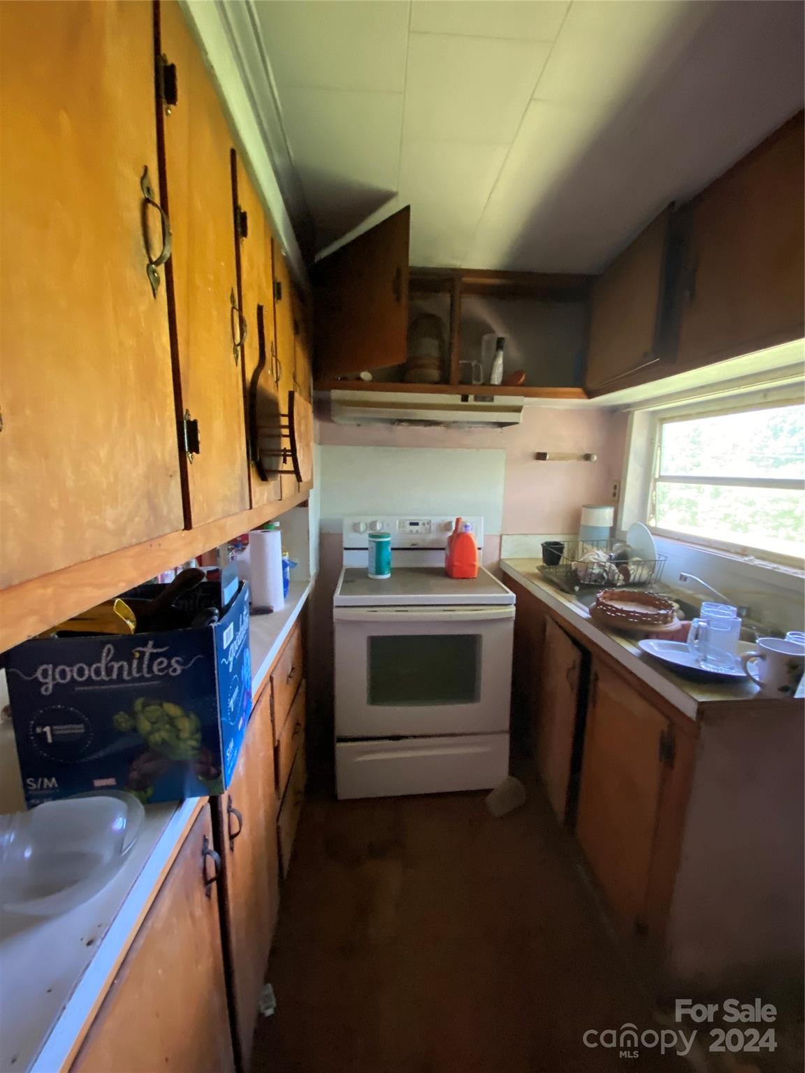 771 Spindale Street Spindale, NC 28160 - Photo 7 of 14 a kitchen with stainless steel appliances a sink a stove and a refrigerator