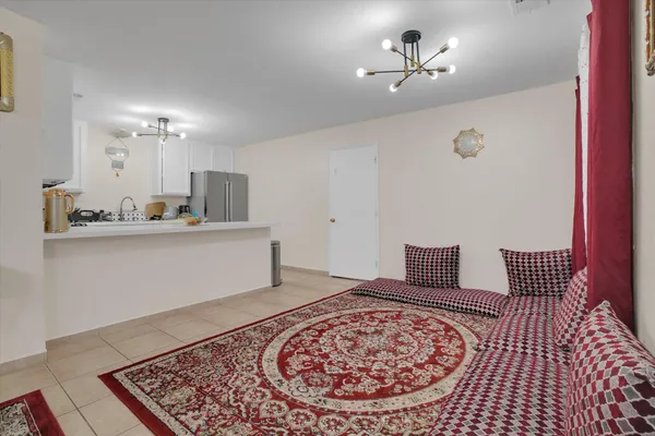 a kitchen with a refrigerator sink and microwave