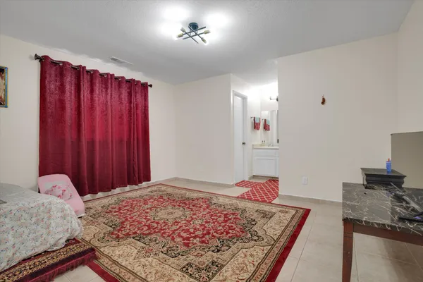 a bedroom with a bed and a closet