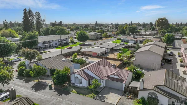 an aerial view of a houses with a street