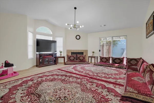 a living room with furniture and a rug