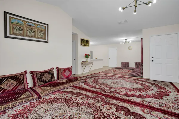a living room with a rug