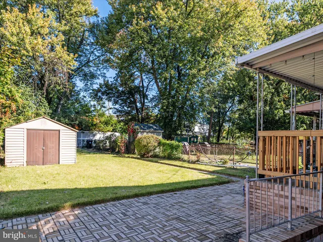 a view of a backyard with a small cabin