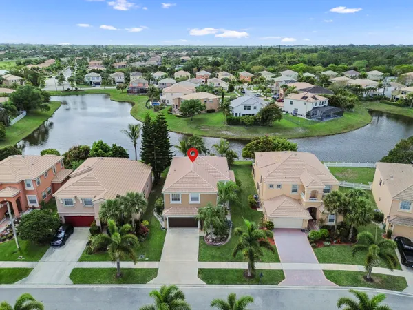 an aerial view of a house with outdoor space and street view