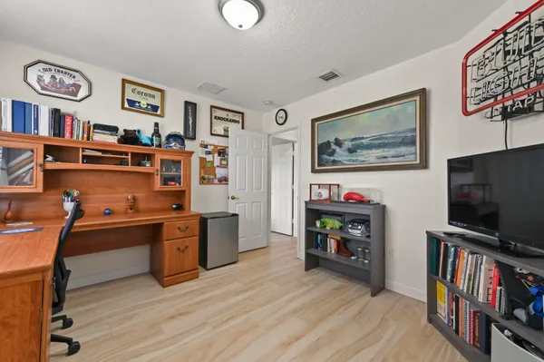 a room with furniture and a flat screen tv