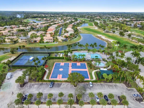 an aerial view of a house with a lake view
