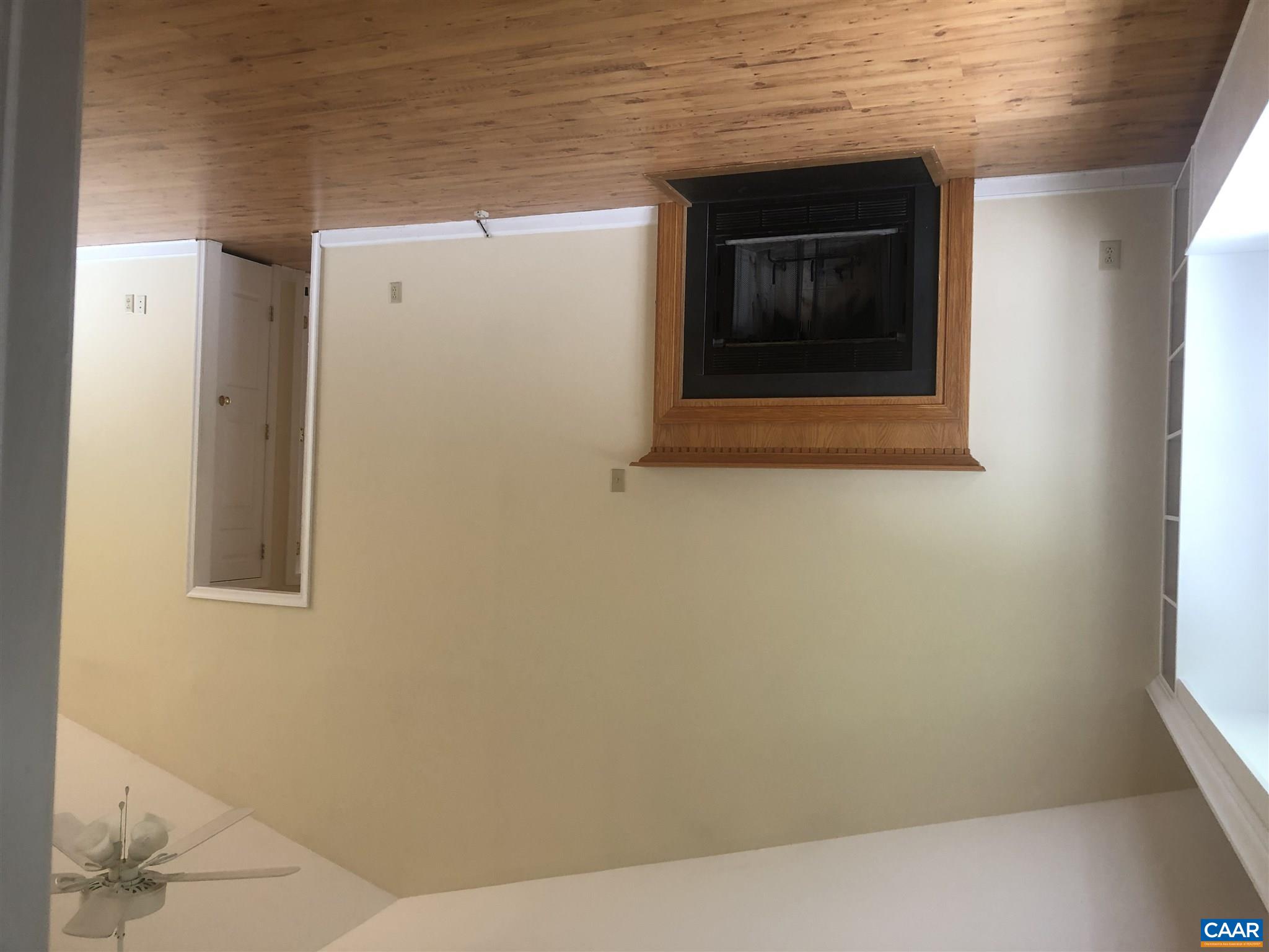 2811 Amicus Road Stanardsville, VA 22973 - Photo 12 of 27 a view of an empty room with wooden floor and a window