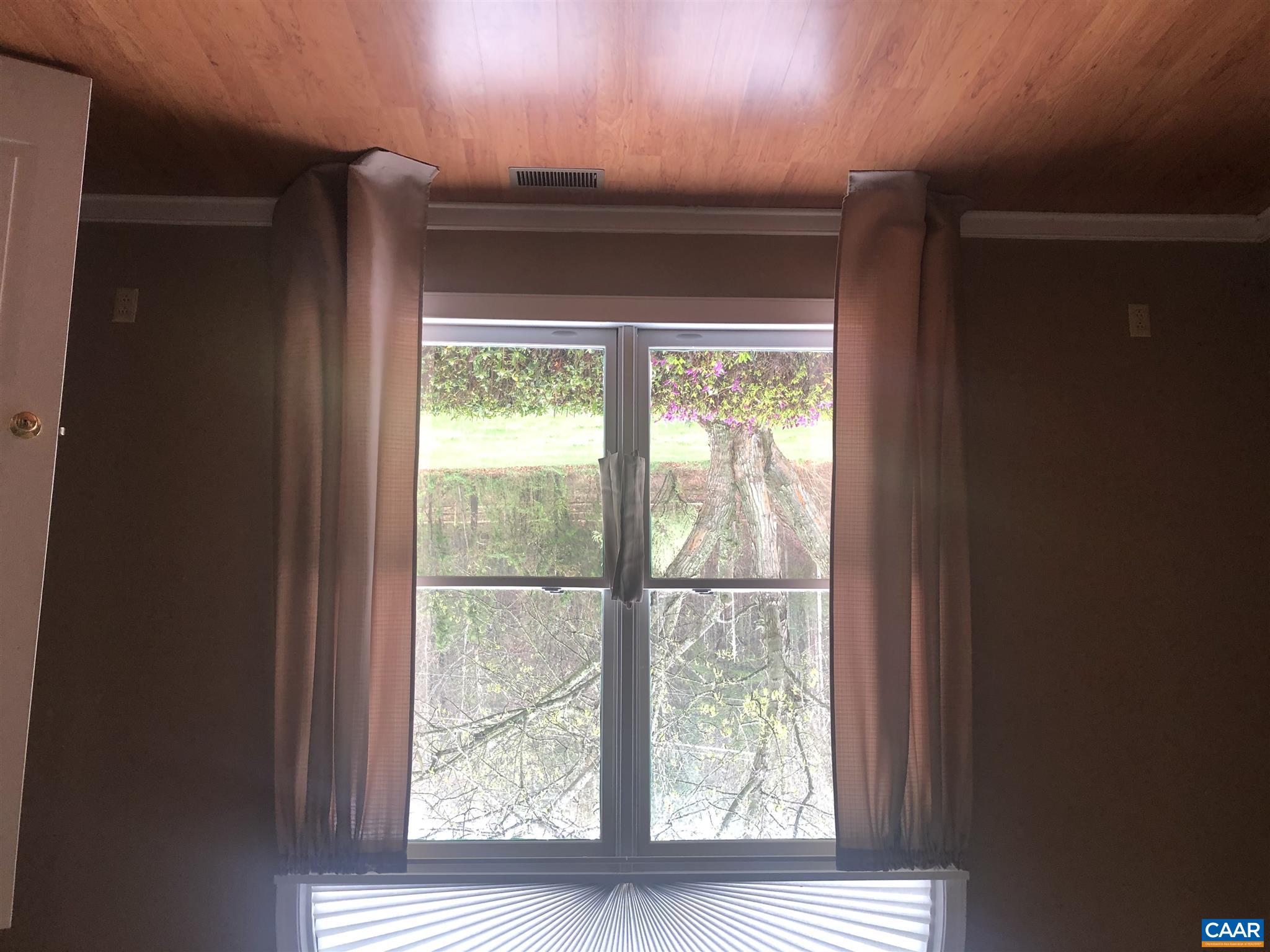 2811 Amicus Road Stanardsville, VA 22973 - Photo 13 of 27 an empty room with wooden floor and windows