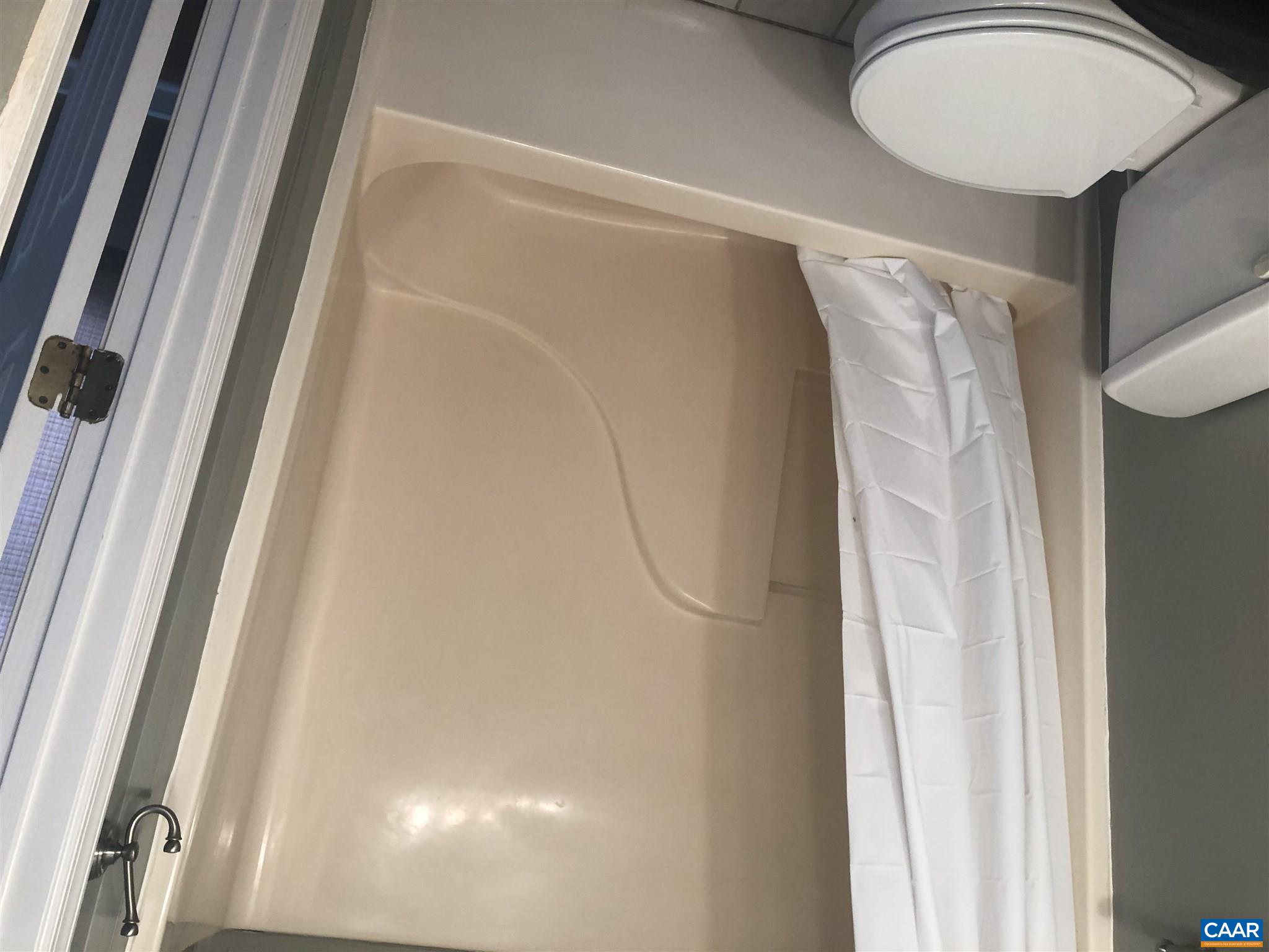 2811 Amicus Road Stanardsville, VA 22973 - Photo 14 of 27 a white toilet sitting next to a bath tub