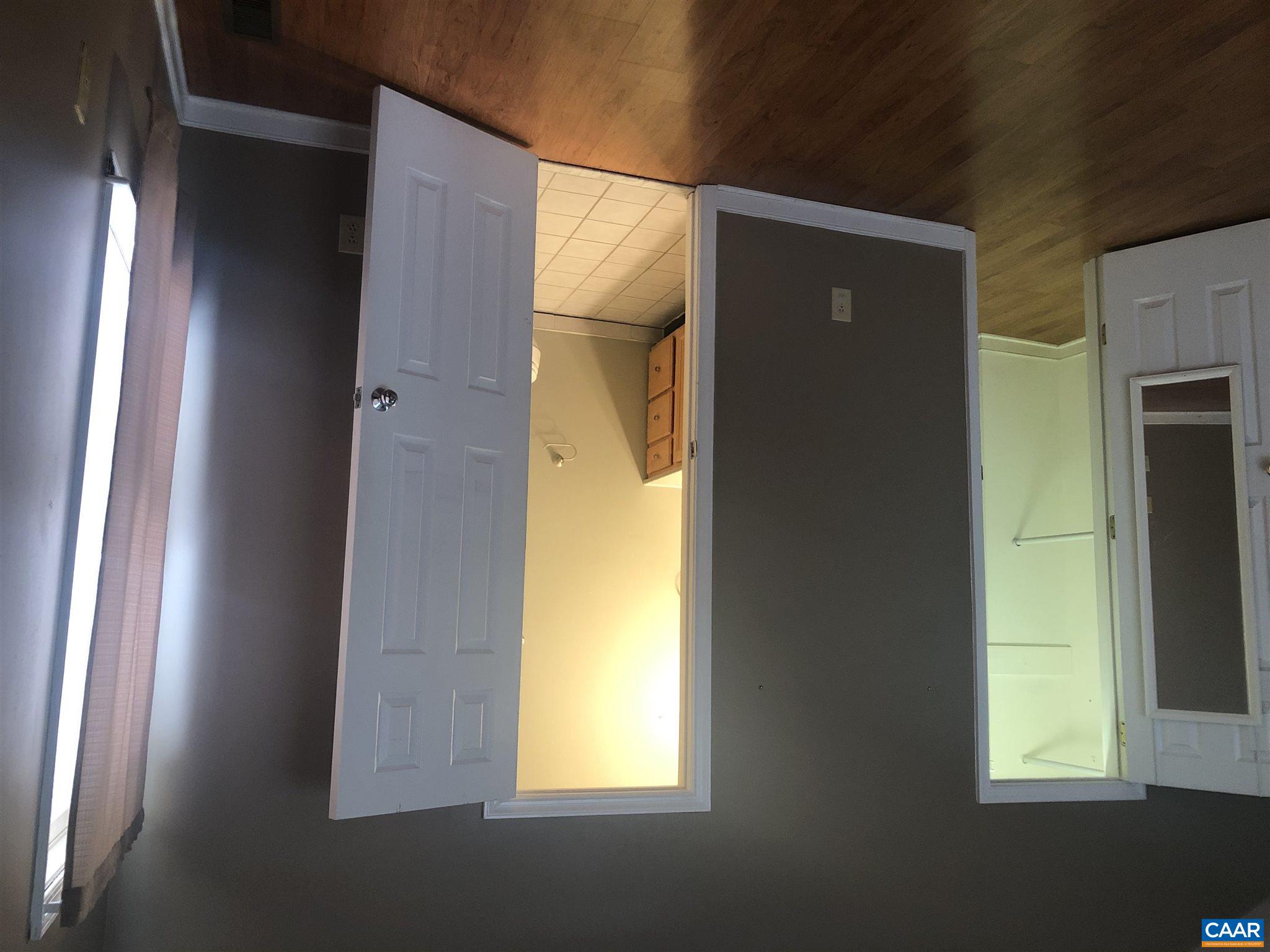 2811 Amicus Road Stanardsville, VA 22973 - Photo 16 of 27 a view of an empty room with wooden floor and a window