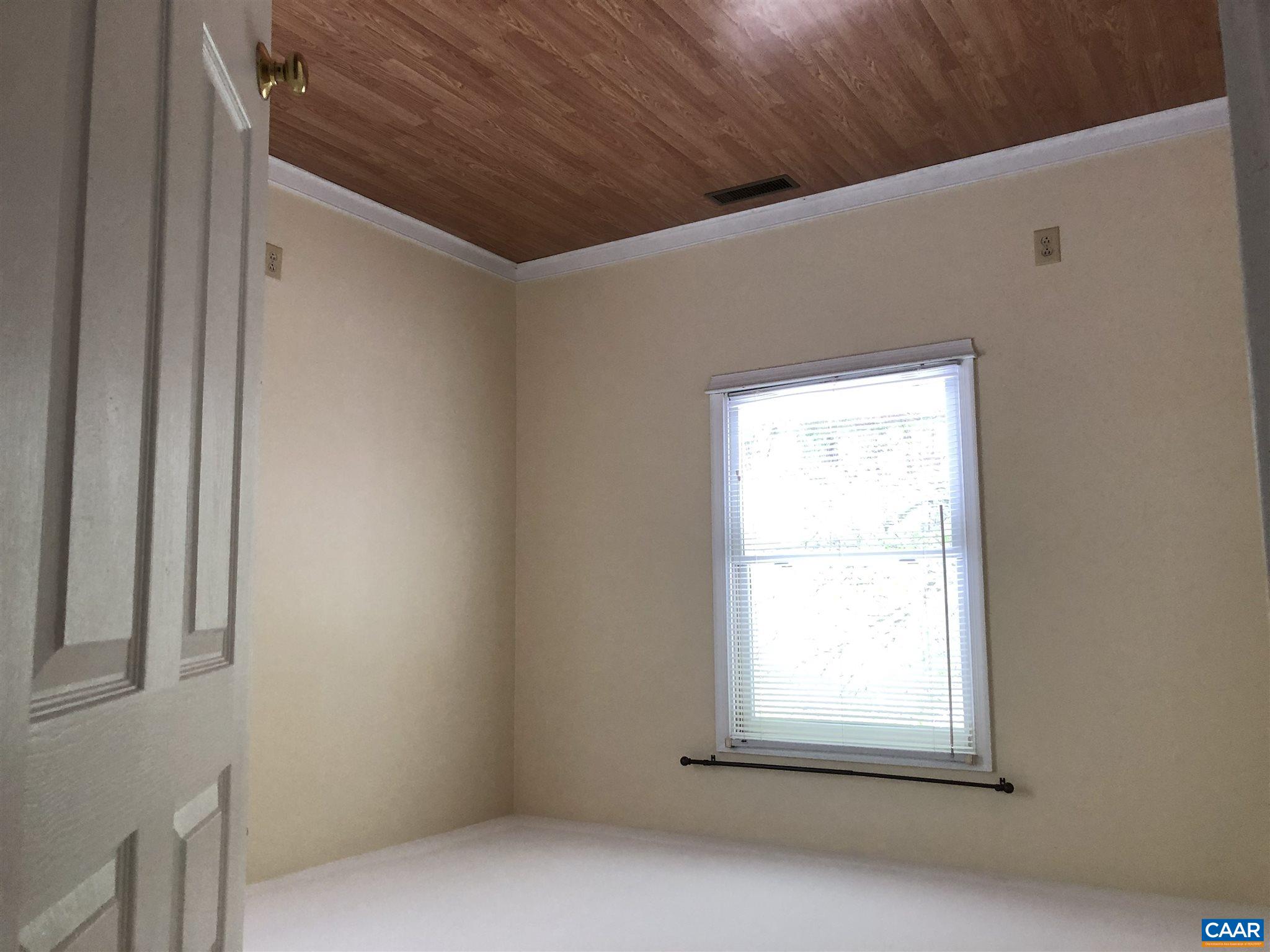 2811 Amicus Road Stanardsville, VA 22973 - Photo 17 of 27 an empty room with wooden floor and windows