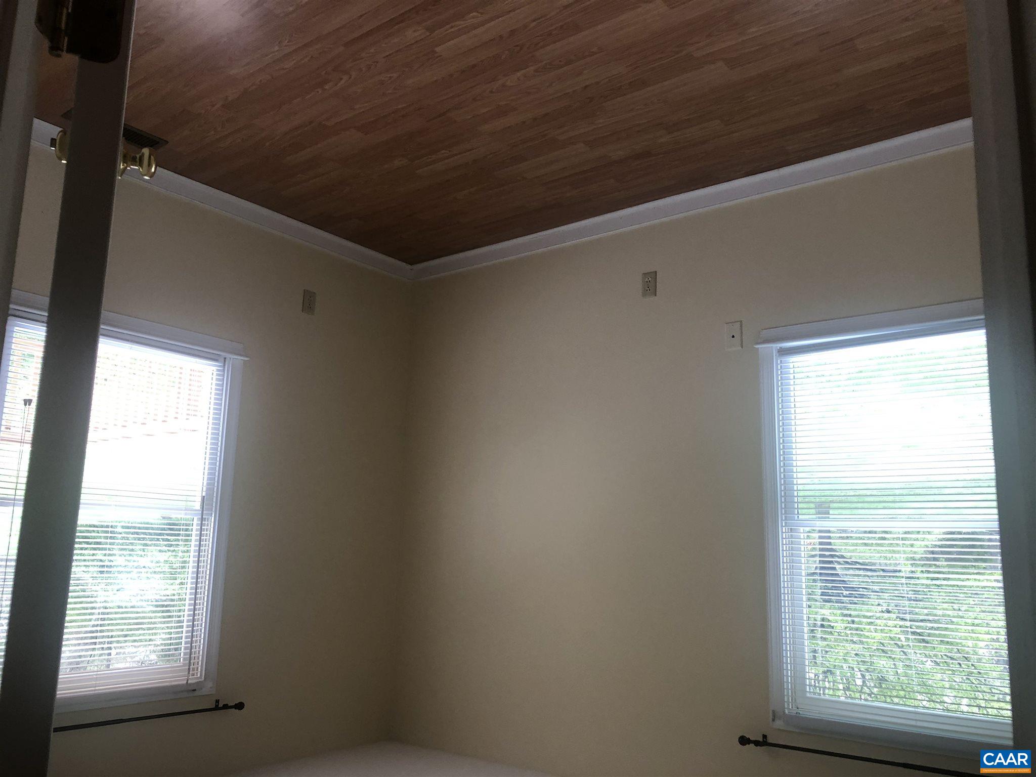 2811 Amicus Road Stanardsville, VA 22973 - Photo 24 of 27 an empty room with wooden floor and windows