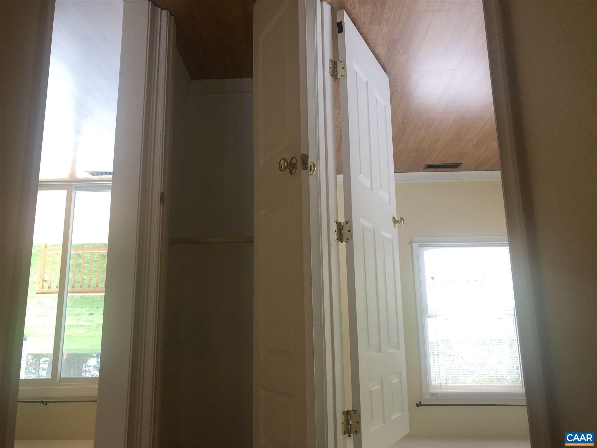 2811 Amicus Road Stanardsville, VA 22973 - Photo 25 of 27 a view of a hallway with wooden floor and closet