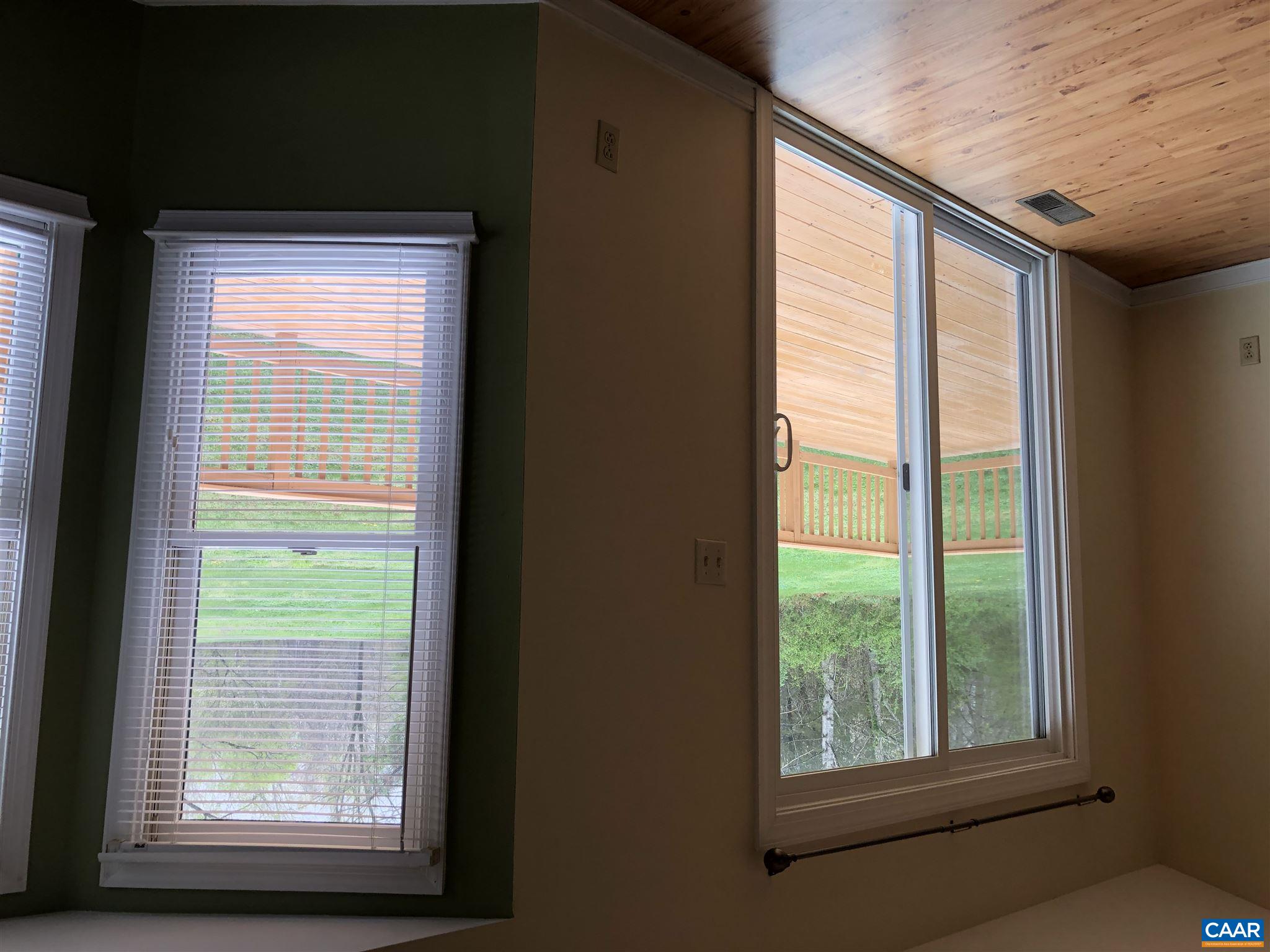 2811 Amicus Road Stanardsville, VA 22973 - Photo 9 of 27 a view of an empty room and wooden floor and windows