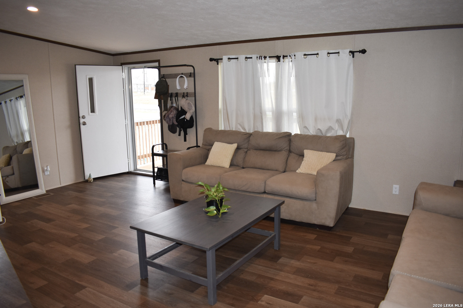 17016 Rancho Escondido Atascosa, TX 78002 - Photo 6 of 14 a living room with furniture and a wooden floor