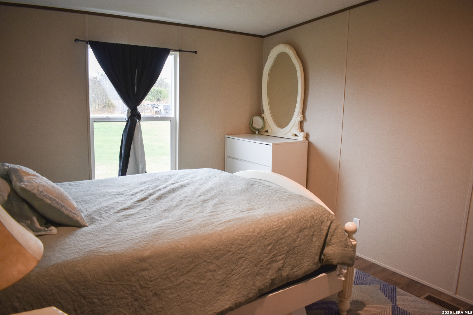 17016 Rancho Escondido Atascosa, TX 78002 - Photo 9 of 14 a bedroom with a bed and a window