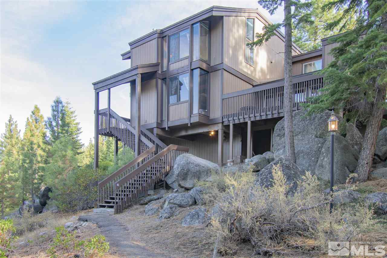 a view of a house with a yard and balcony