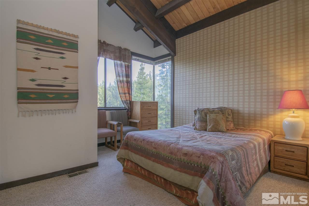 46 Chalet Stateline, NV 89449 - Photo 11 of 18 a bedroom with a bed and wooden floor