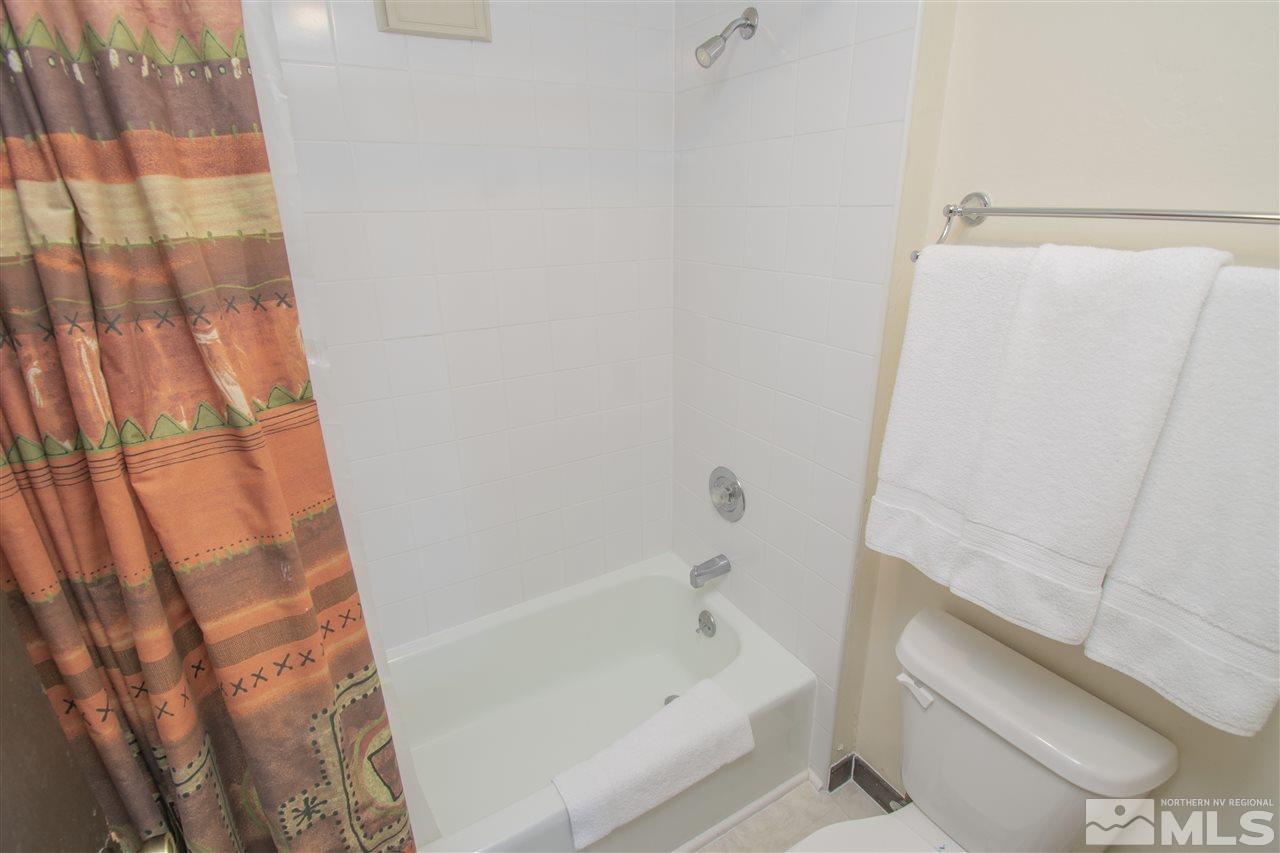 46 Chalet Stateline, NV 89449 - Photo 13 of 18 a bathroom with a bathtub and a shower