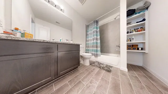 a view of kitchen with refrigerator and window