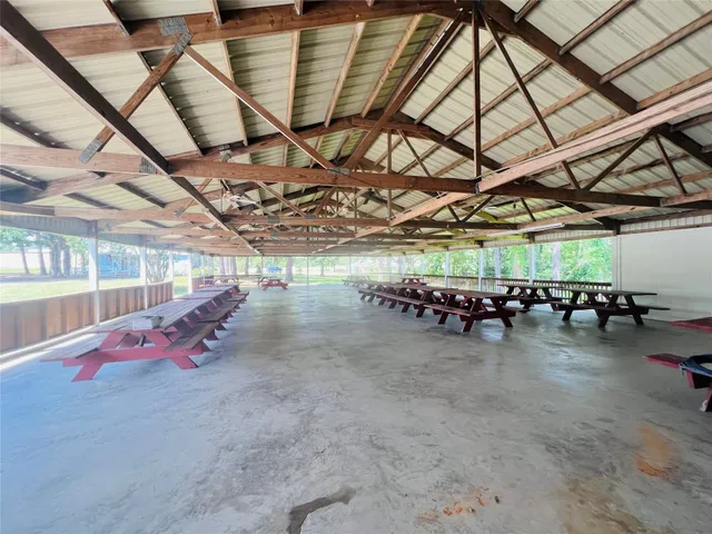 a view of a house with backyard porch and sitting area