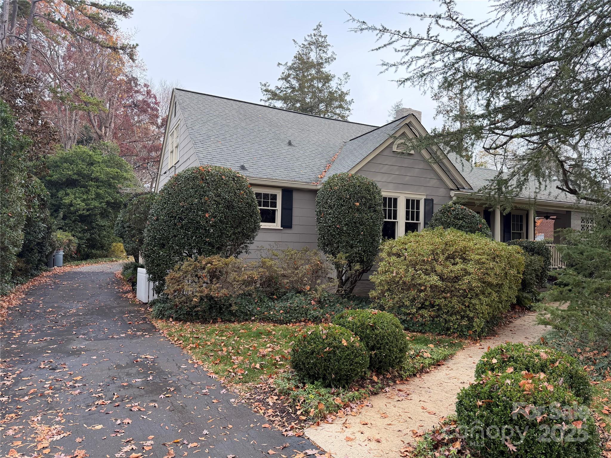 2629 Sharon Road Charlotte, NC 28211 - Photo 4 of 4 a front view of house with a yard and green space
