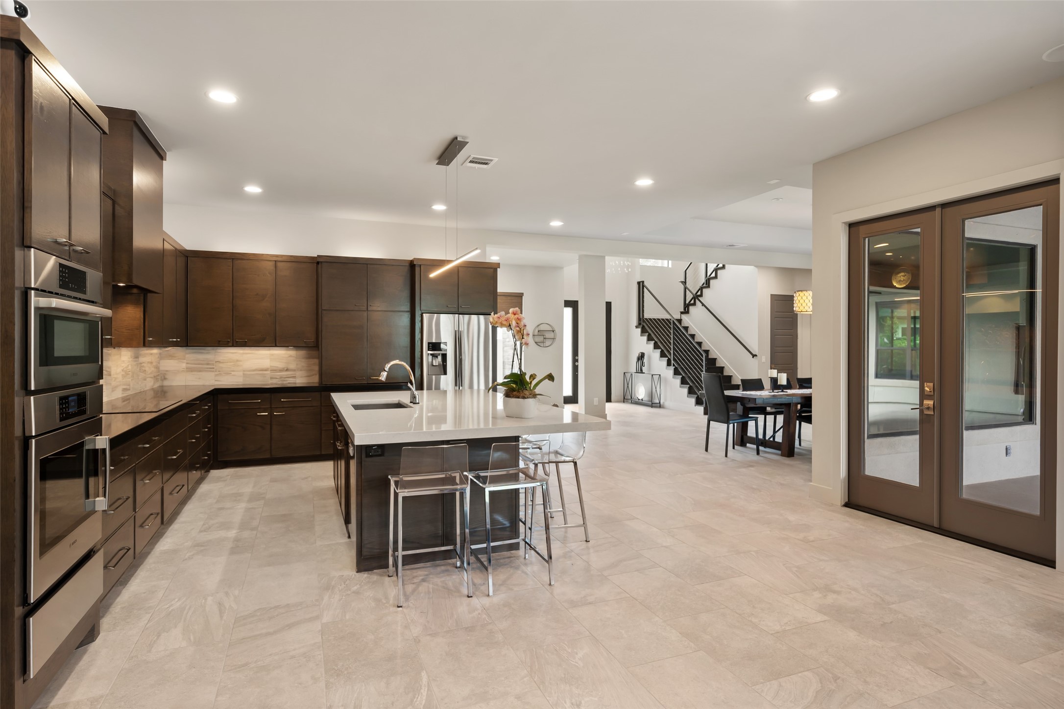 24902 Delaney Knoll Spring, TX 77389 - Photo 6 of 49 a large white kitchen with a large counter top and appliances