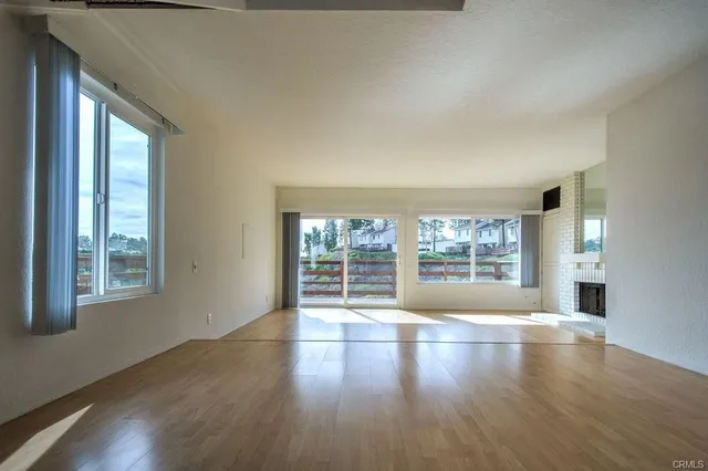 a view of an empty room and window
