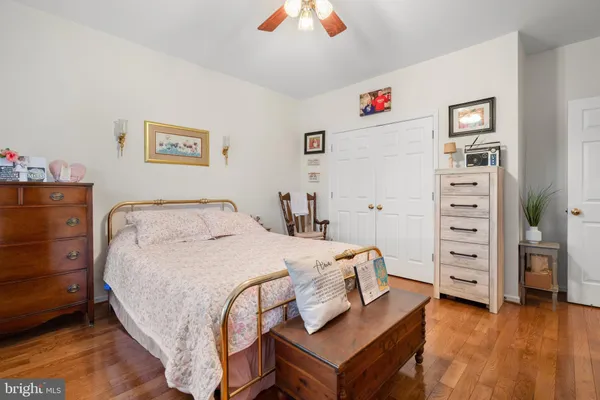 a bedroom with a bed and a tv