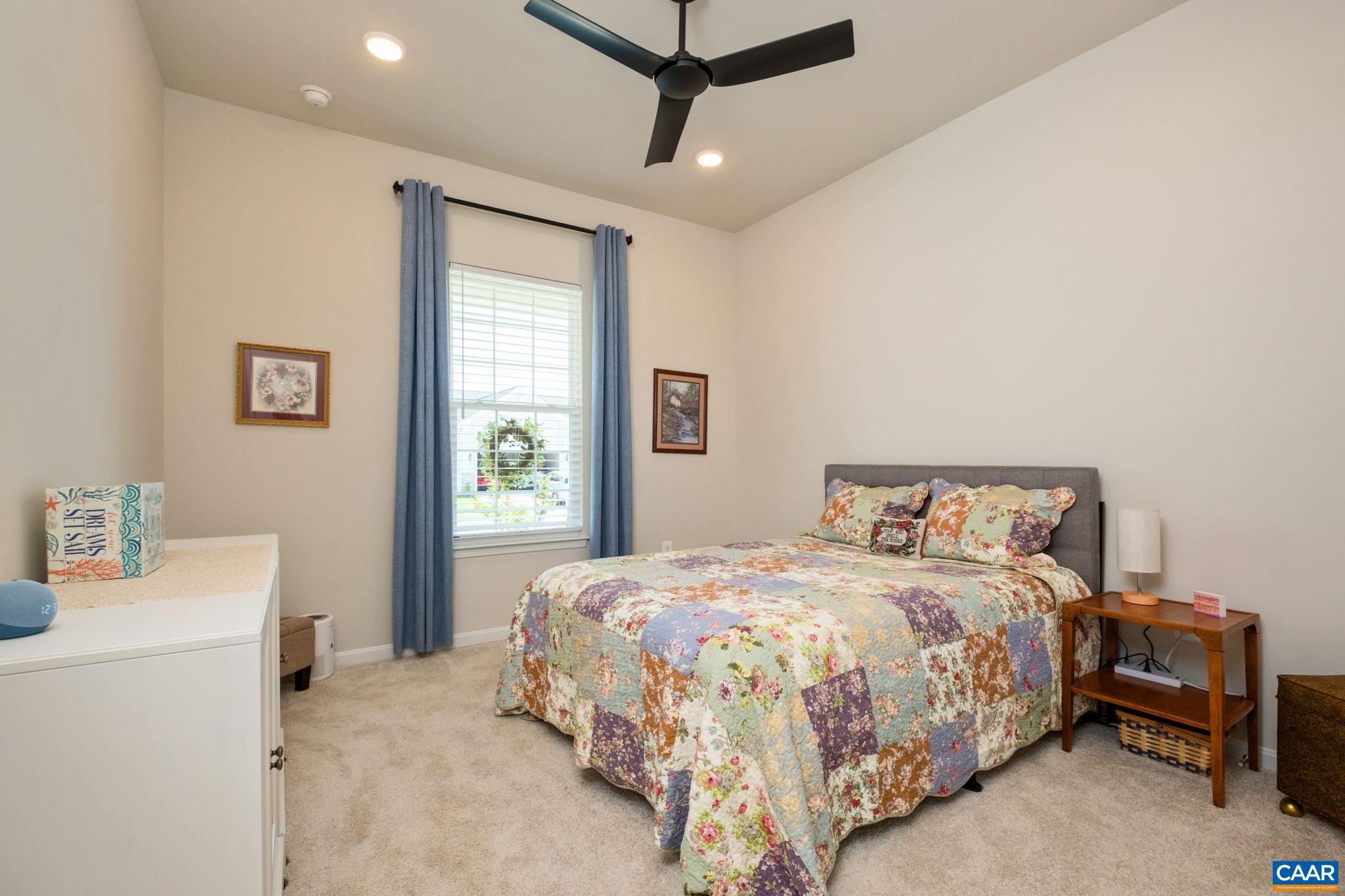 124 Stodghill Drive Ruckersville, VA 22968 - Photo 10 of 58 a bedroom with a bed and a table