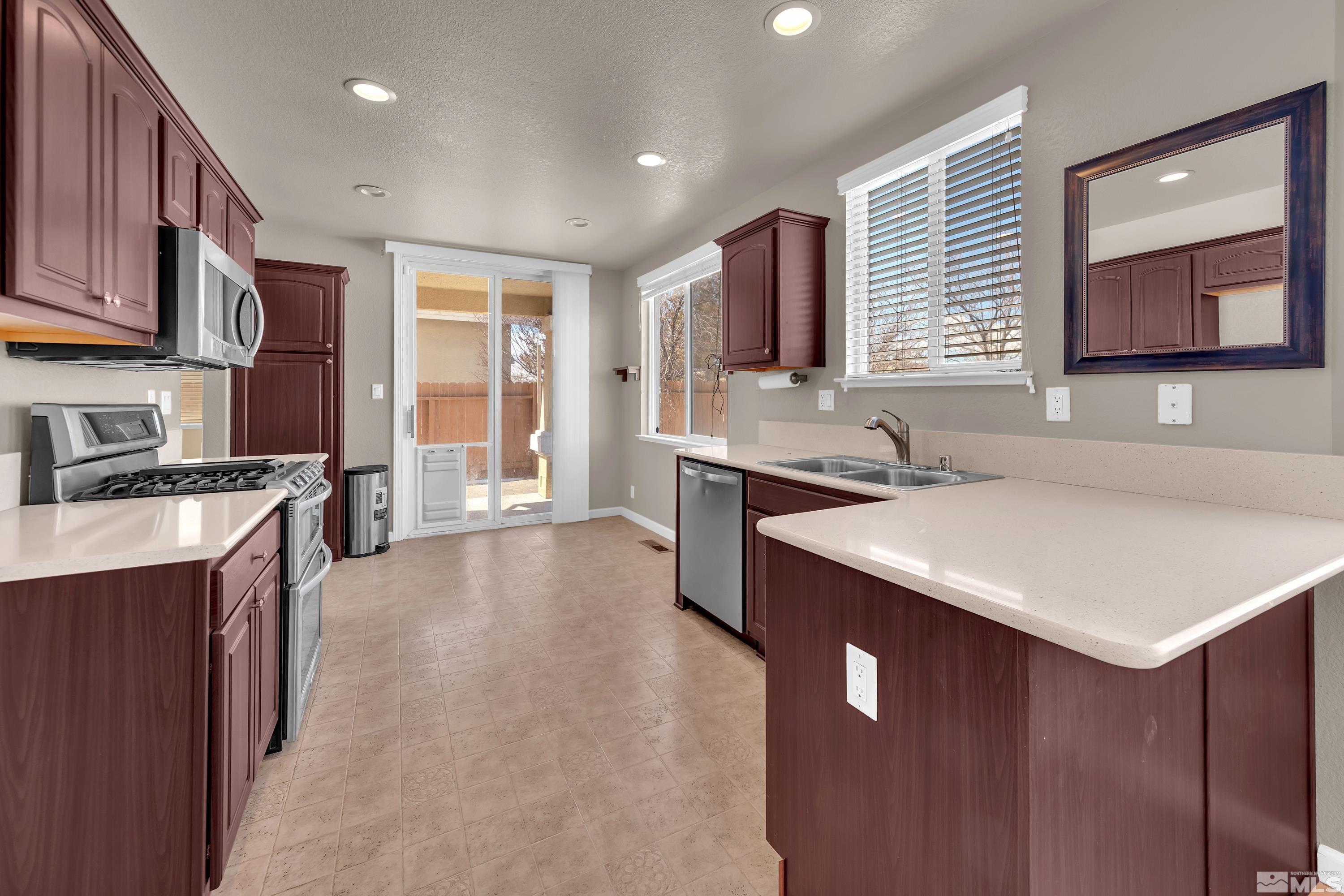 2325 Lincoln Meadows Drive Reno, NV 89521 - Photo 12 of 40 a kitchen a sink a counter top space and appliances