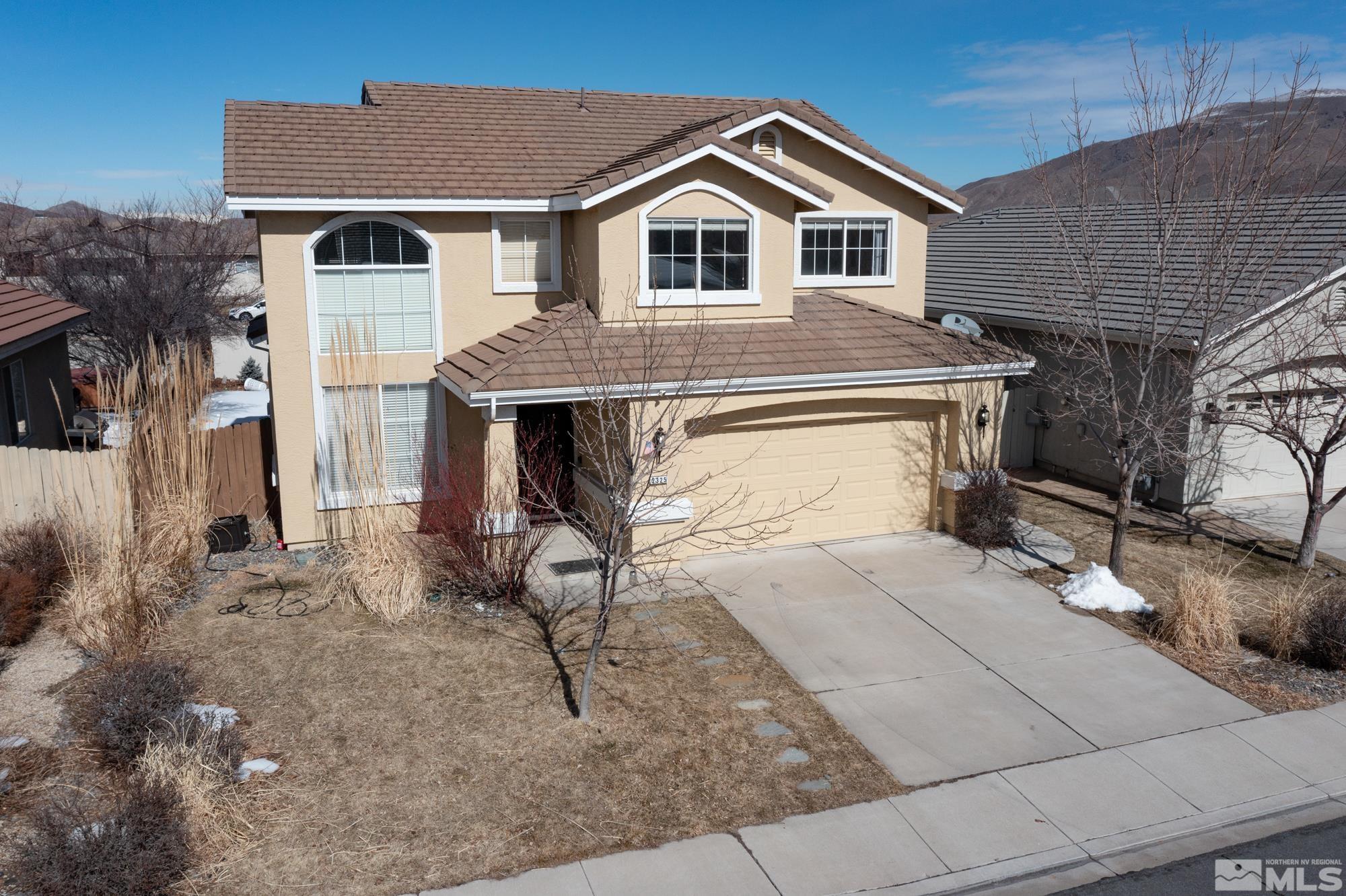 2325 Lincoln Meadows Drive Reno, NV 89521 - Photo 2 of 40 a front view of a house with garden