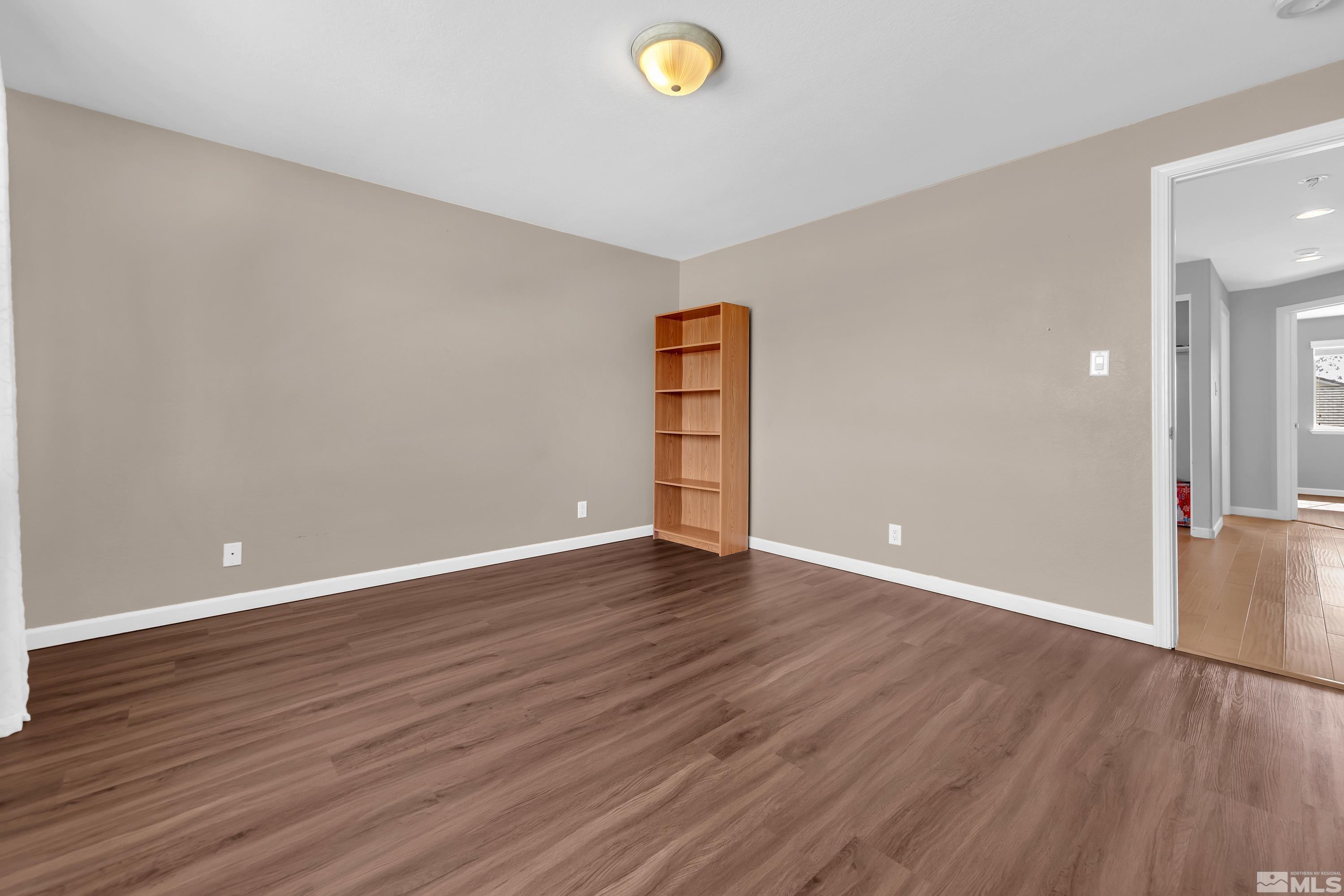 2325 Lincoln Meadows Drive Reno, NV 89521 - Photo 22 of 40 a view of an empty room and wooden floor