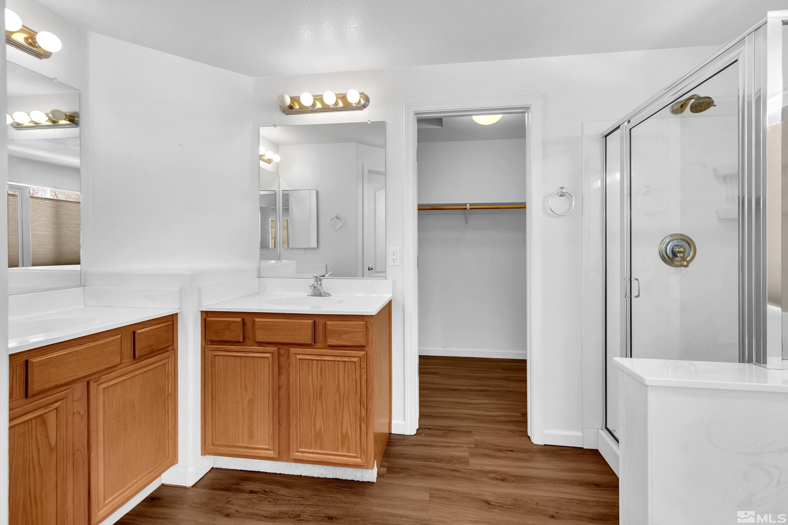 2325 Lincoln Meadows Drive Reno, NV 89521 - Photo 23 of 40 a bathroom with a sink and a mirror