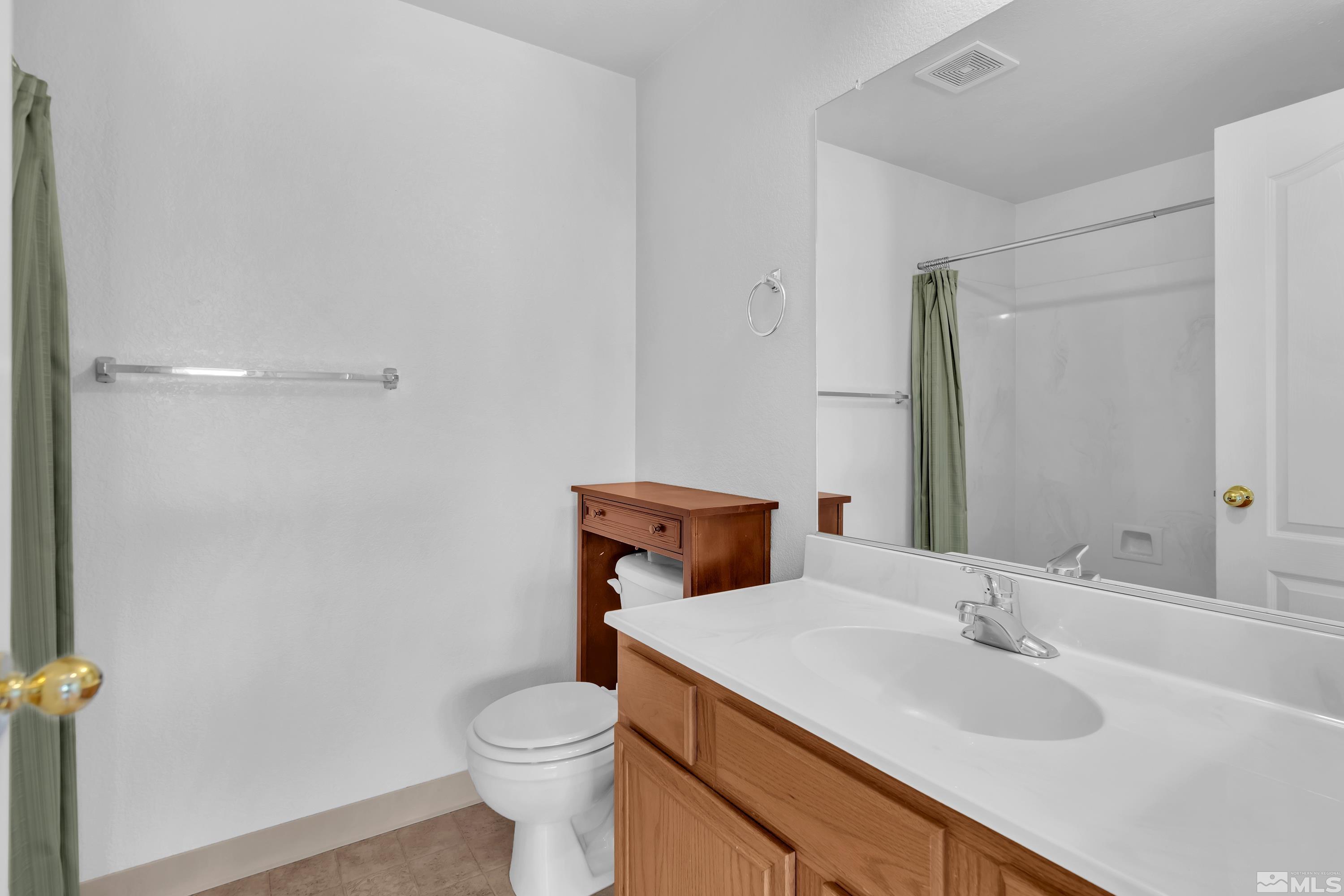 2325 Lincoln Meadows Drive Reno, NV 89521 - Photo 30 of 40 a bathroom with a sink and a toilet