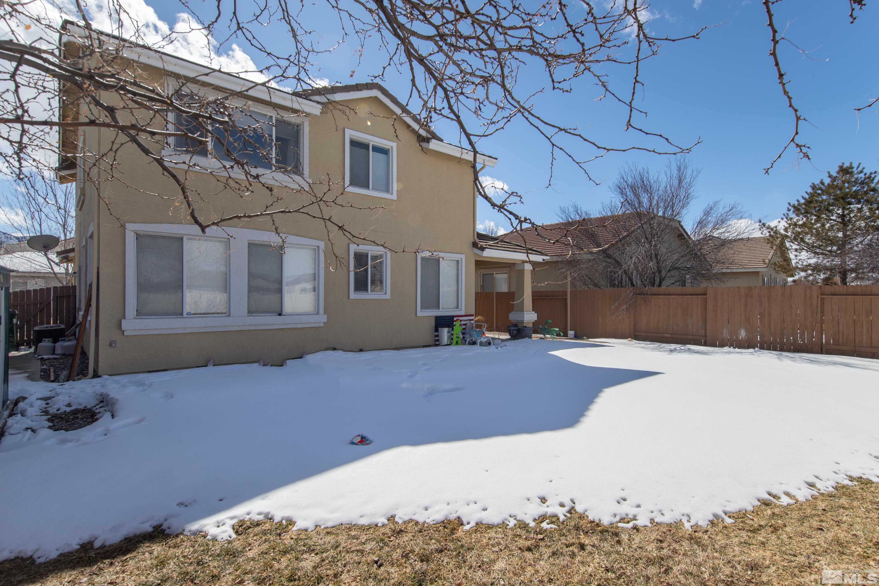 2325 Lincoln Meadows Drive Reno, NV 89521 - Photo 33 of 40 a view of a house with a snow in the yard