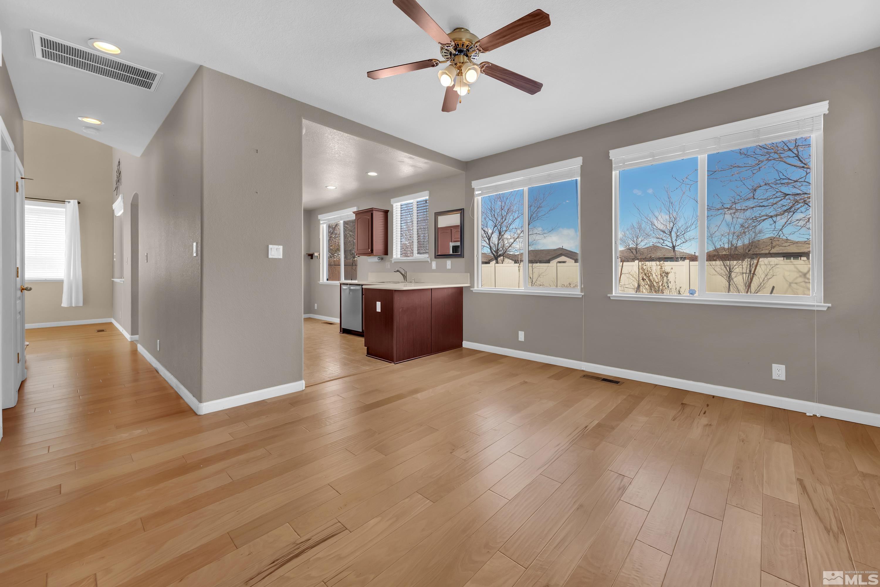 2325 Lincoln Meadows Drive Reno, NV 89521 - Photo 9 of 40 a view of livingroom with hardwood floor and a ceiling fan