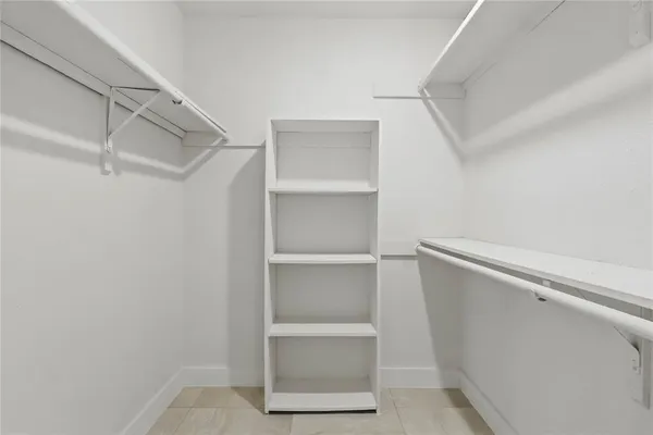 a view of an empty walk in closet