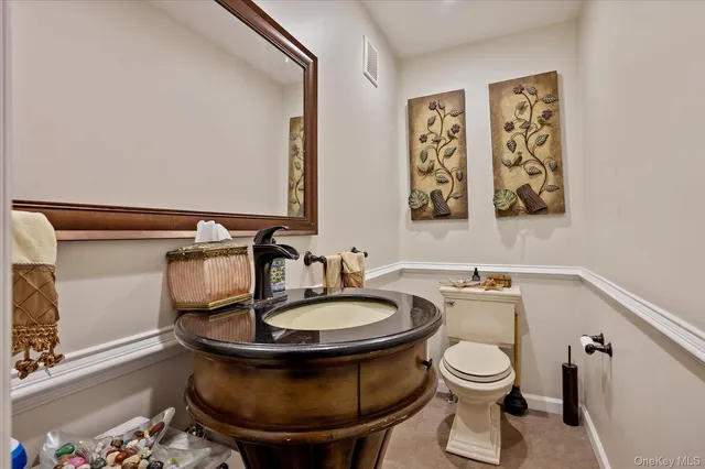 a bathroom with a toilet and a sink