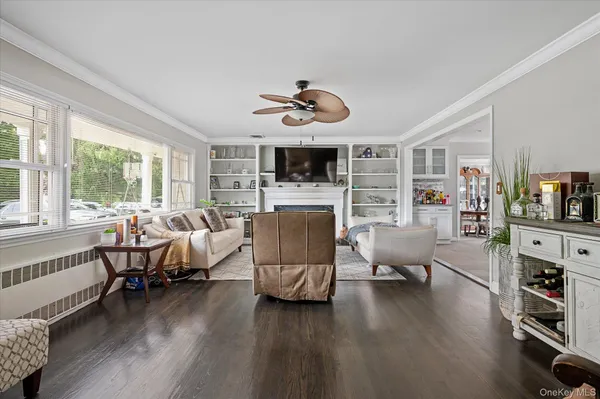 a living room with furniture fireplace and flat screen tv