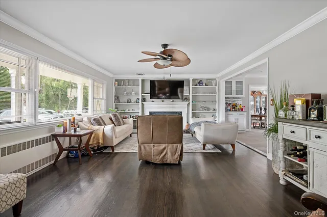a living room with furniture fireplace and flat screen tv