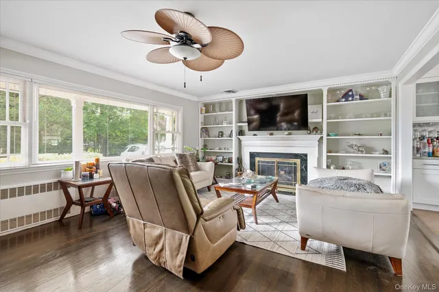 a living room with furniture fireplace and a flat screen tv