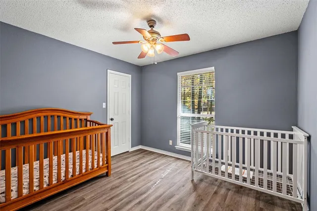 a view of hallway with wooden floor
