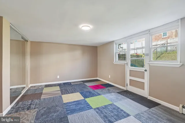 a room that has a rug and a window