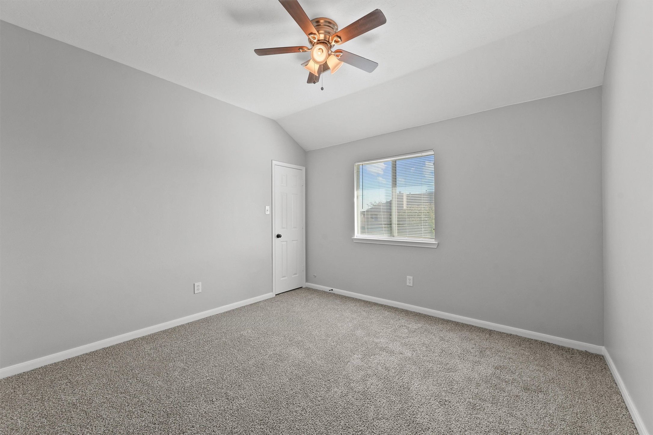 9107 Huckinston Court Spring, TX 77379 - Photo 18 of 32 an empty room with a window and a fan