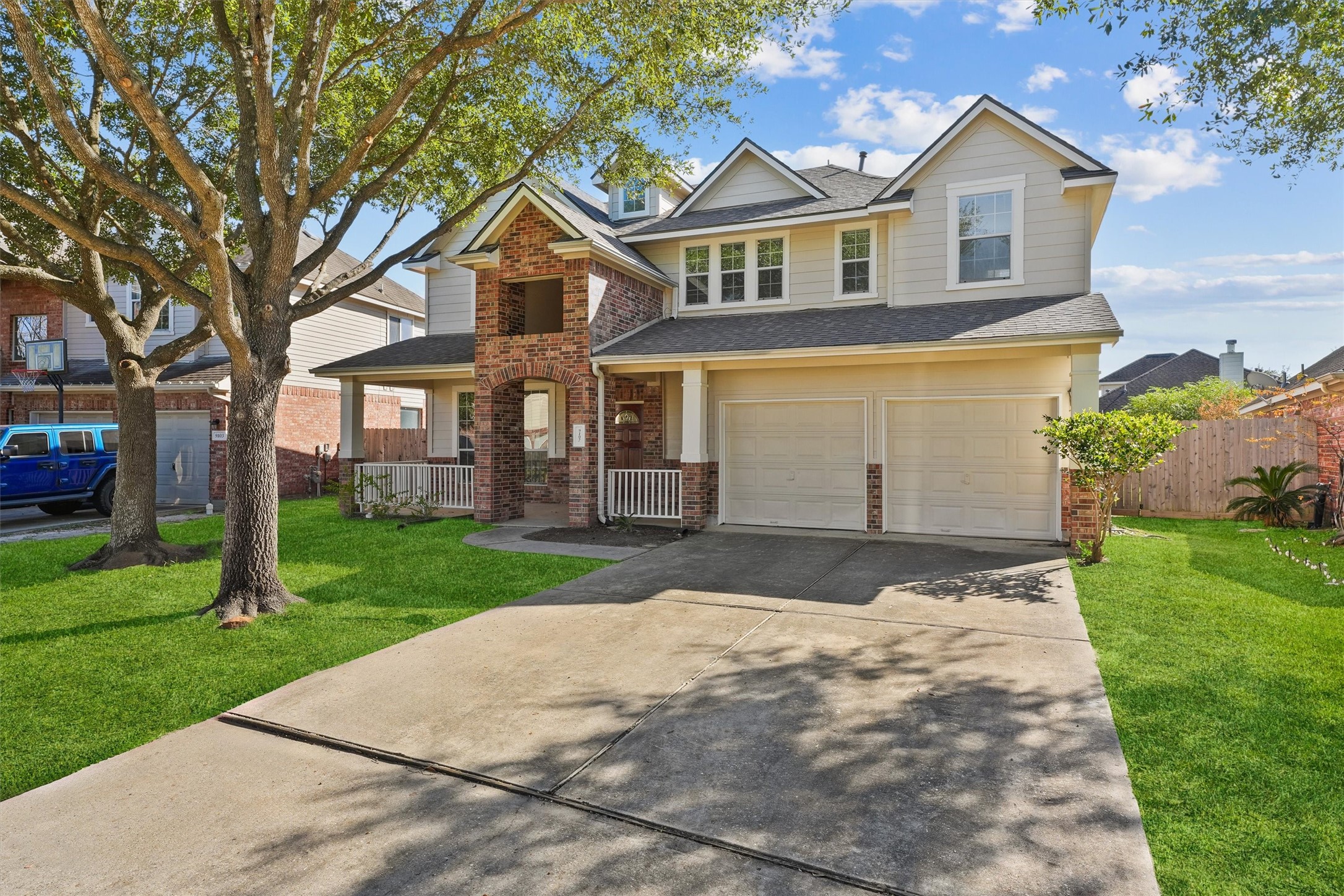 9107 Huckinston Court Spring, TX 77379 - Photo 2 of 32 a front view of a house with a yard
