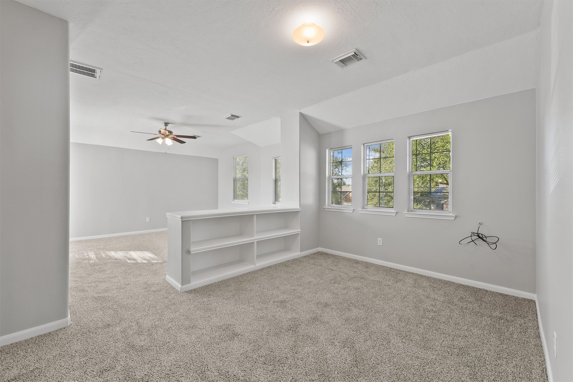 9107 Huckinston Court Spring, TX 77379 - Photo 22 of 32 a view of an empty room with a window