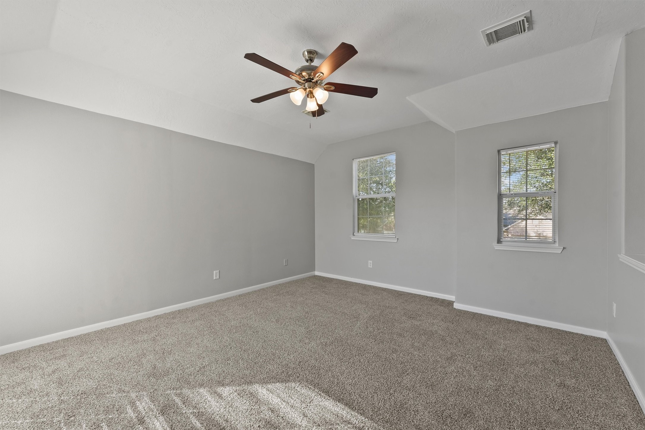 9107 Huckinston Court Spring, TX 77379 - Photo 24 of 32 a view of a livingroom with a ceiling fan and window